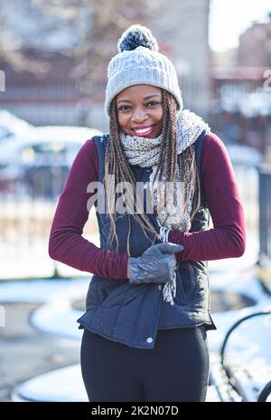 She wears winter well. Portrait of a beautiful young woman enjoying a wintery day outdoors. Stock Photo