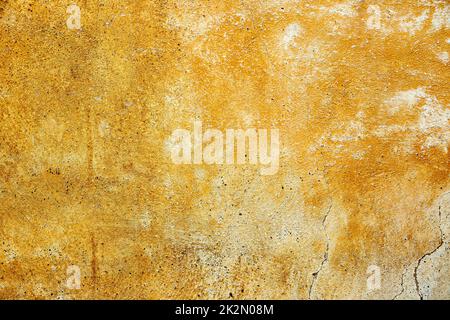 yellow weathered paint on a plastered wall Stock Photo