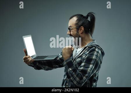 Exuberant ecstatic man exclaiming - OMG I've won! Stock Photo