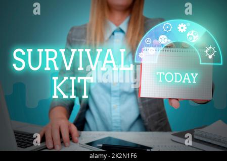 Inspiration showing sign Survival Kit. Word for Emergency Equipment Collection of items to help someone Lady in suit holding notepad representing innovative thinking. Stock Photo