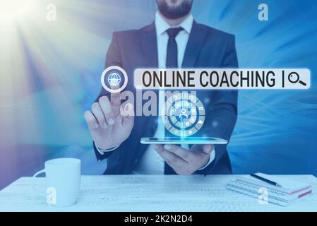 Hand writing sign Online Coaching. Conceptual photo Learning from online and internet with the help of a coach Man holding Screen Of Mobile Phone Showing The Futuristic Technology. Stock Photo