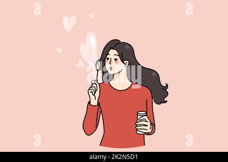 Happy girl blow soap bubbles with hearts Stock Photo