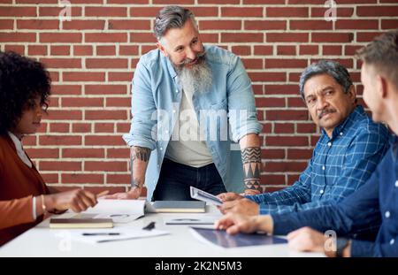 businessman team leader meeting with colleagues in office discussing ideas for company development Stock Photo
