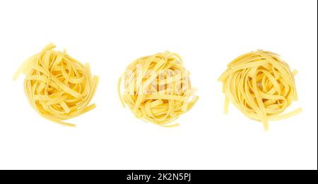 Three uncooked tagliatelle pasta nests, in a row, Italian egg pasta Stock Photo