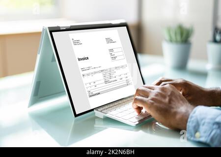 Young Businessman Using Laptop Stock Photo