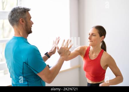 Fight Sparring Fitness Training In Gym. Female Power Stock Photo