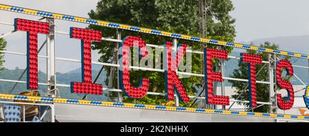 E Ticket Ride Sign electric CIRCUS sign on a scaffolding in the night Stock Photo - Alamy