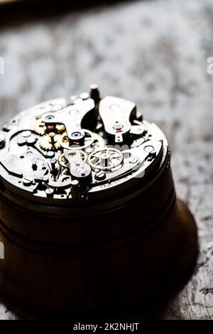 fascinating antique watch mechanism on repair table Stock Photo