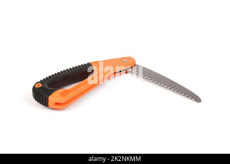 Folding garden saw in the folded state isolated on a white background, pocket saw. High resolution photo. Full depth of field. Stock Photo