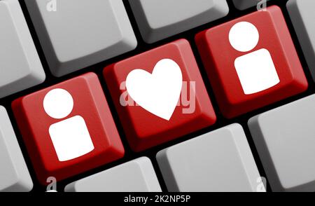 Love and Dating online - Red computer keyboard 3D illustration Stock Photo