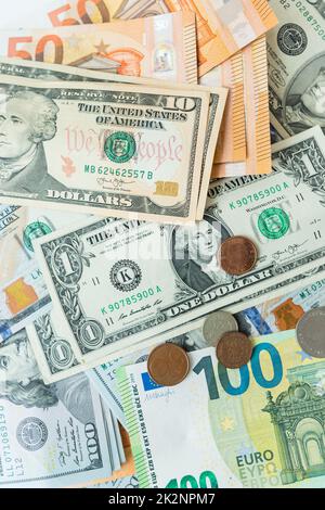 Multicurrency banknotes, coins. The concept of the world economy during the crisis. Money rules in world events, the stock exchange and the trade link between countries. Stock Photo