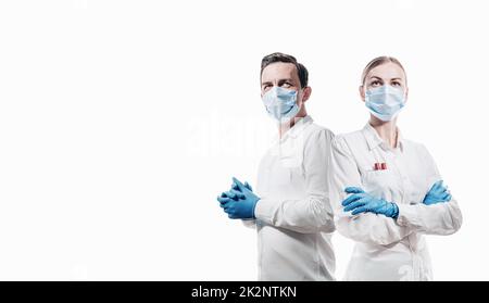 doctors man and woman on a white background in medical masks on the face Stock Photo
