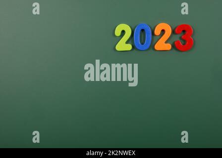 2023 year written in bright plastic magnetic letters stuck on a magnetic board Stock Photo