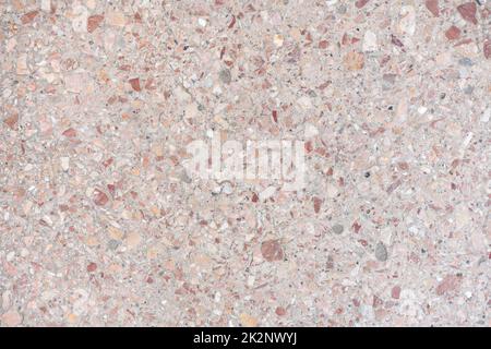 Marble crushed stone texture. Wall or floor of small gravel stones mixed with marble. High resolution photo. Full depth of field. Stock Photo