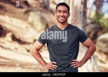I love my morning runs. Portrait of a sporty young man exercising outdoors. Stock Photo