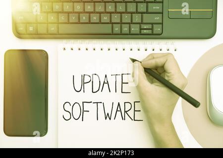 Text caption presenting Update Software. Conceptual photo replacing program with a newer version of same product Office Supplies Over Desk With Keyboard And Glasses And Coffee Cup For Working Stock Photo