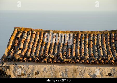 Roof and wall of an abandoned house. Stock Photo