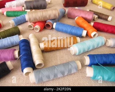 Sewing thread in different colors Stock Photo
