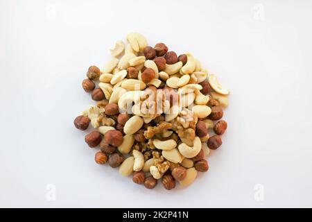 Mixture hazelnuts almonds walnuts cashews on pile Stock Photo