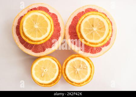 Citrus fruits being cut in half Stock Photo