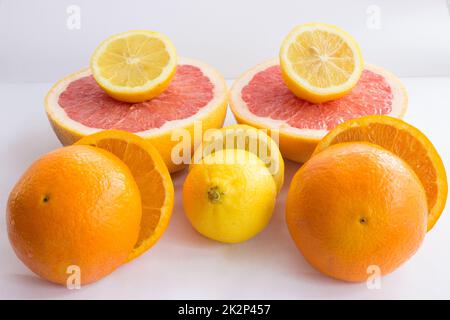 Citrus fruits being cut in half Stock Photo