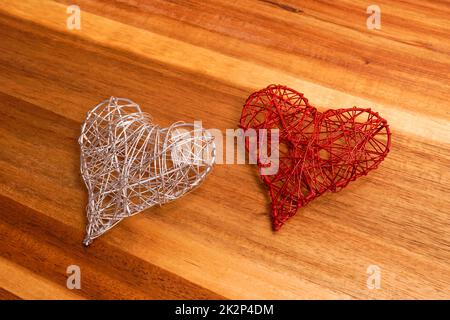 Hearts as a symbol of love on a wooden background Stock Photo