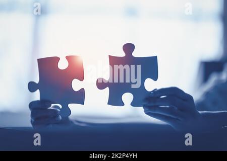 Human holding pieces of jigsaw in his hands. Stock Photo