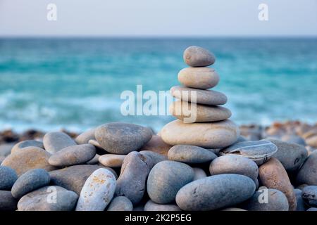 Zen balanced stones stack on beach Stock Photo