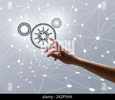 Woman's hand on a gray background with line connections and dots. Business process management and workflow automation diagram with gear Stock Photo