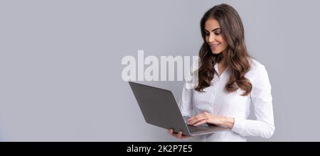E-learning even from far away. Happy girl student use laptop. E-learning. Distance education. Woman isolated face portrait, banner with copy space. Stock Photo