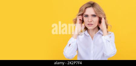 Unhappy ill woman touch ears suffering from ear pain yellow background, earache. Woman isolated face portrait, banner with mock up copy space. Stock Photo