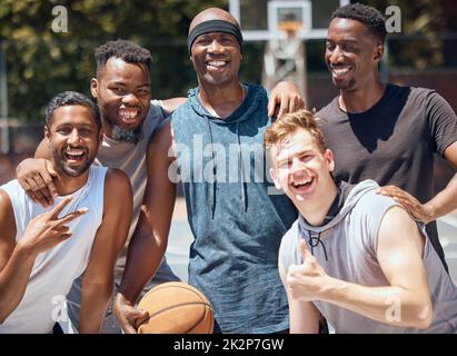 Portrait, sports or basketball team at court training for a game, match or competition with a smile. Athletes, workout and diverse group photo of men Stock Photo