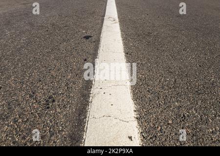 Asphalt road with single solid white line road marking Stock Photo