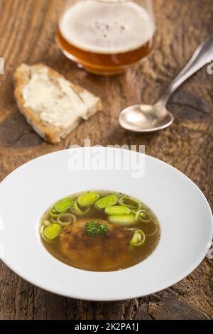 austrian cheese dumpling soup on wood Stock Photo