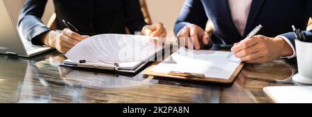 Two Business Colleagues Working Together In Office Stock Photo