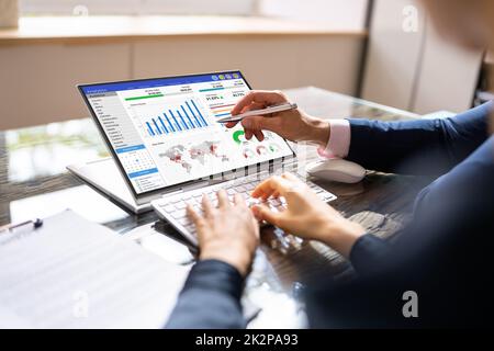 Financial Analyst Using Convertible Laptop Screen Stock Photo