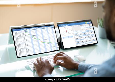 Scheduling Plan Using Cloud Software Stock Photo