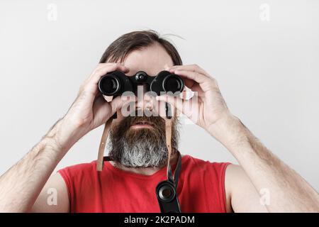 Man with binoculars Stock Photo