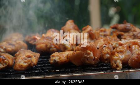 Fresh chicken steak grill meat on fire. Making barbecue on the grill Stock Photo