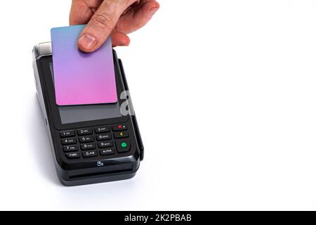 Attached plastic card to the payment terminal with a man's hand on a white isolated background, copy space Stock Photo