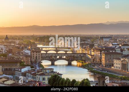 City of Florence at sunset with the Ponte Vecchio bridge Stock Photo