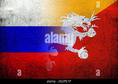 National flag of Russian Federation with Kingdom of Bhutan National flag. Grunge background Stock Photo