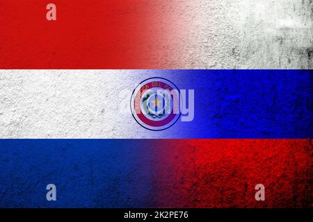 National flag of Russian Federation with The Republic of Paraguay National flag. Grunge background Stock Photo