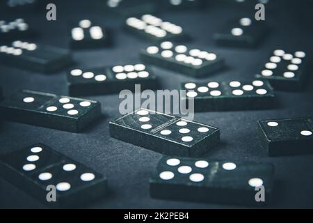 Black dominoes on dark table background Stock Photo