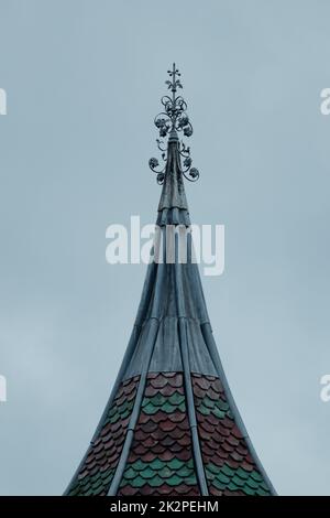 A vertical shot of the top of a Chinese Bell Tower with Colourful Tiles Stock Photo