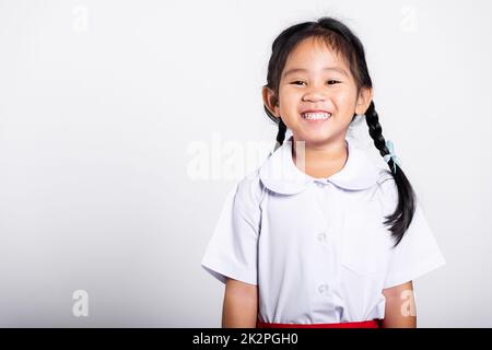 Little asian (thai) girl painting her palm using multicolored