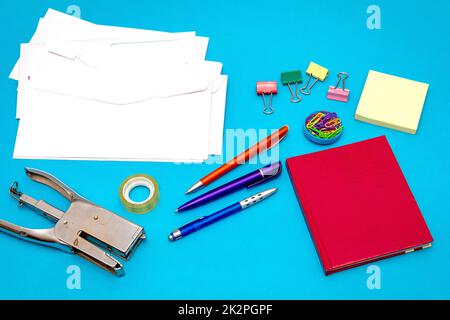 Office stationery objects on blue background Stock Photo
