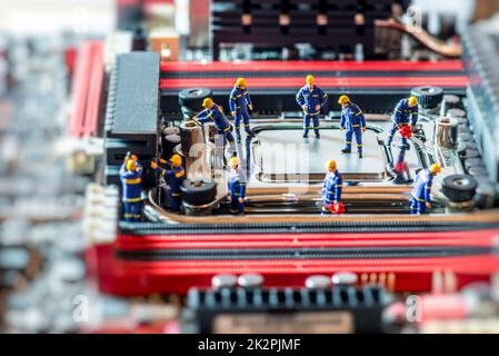 Group of Technicians repairing CPU. Technology concept Stock Photo