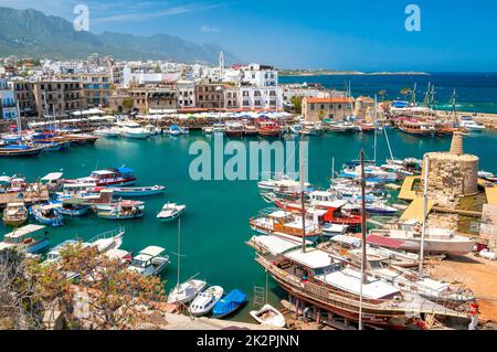 KYRENIA, CYPRUS - APRIL 26, 2014 - View of a historic harbour and part of the old town from the roof of medieval castle. Stock Photo
