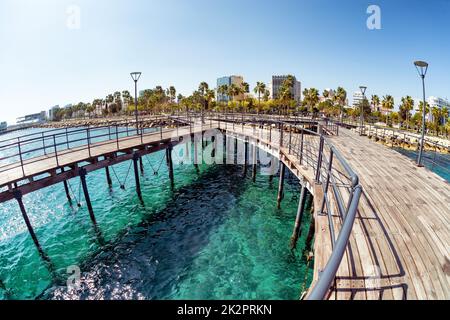 View of Molos Promenade from the wooden pier on the coast of Limassol. Cyprus Stock Photo